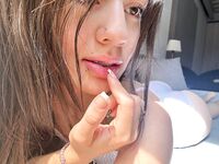 Solo Model with Long Brunette Hair Lauumiau Poses for a Tease Shoot
